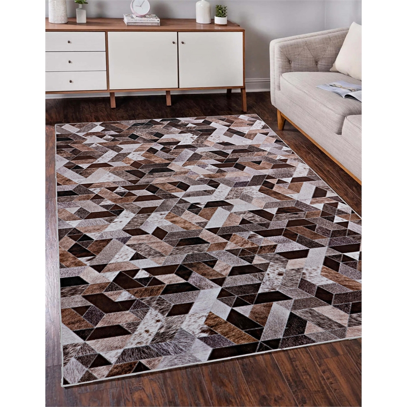 Bowery Hill Patchwork Polyester Faux Cowhide 5' X 7' Area Rug in Brown