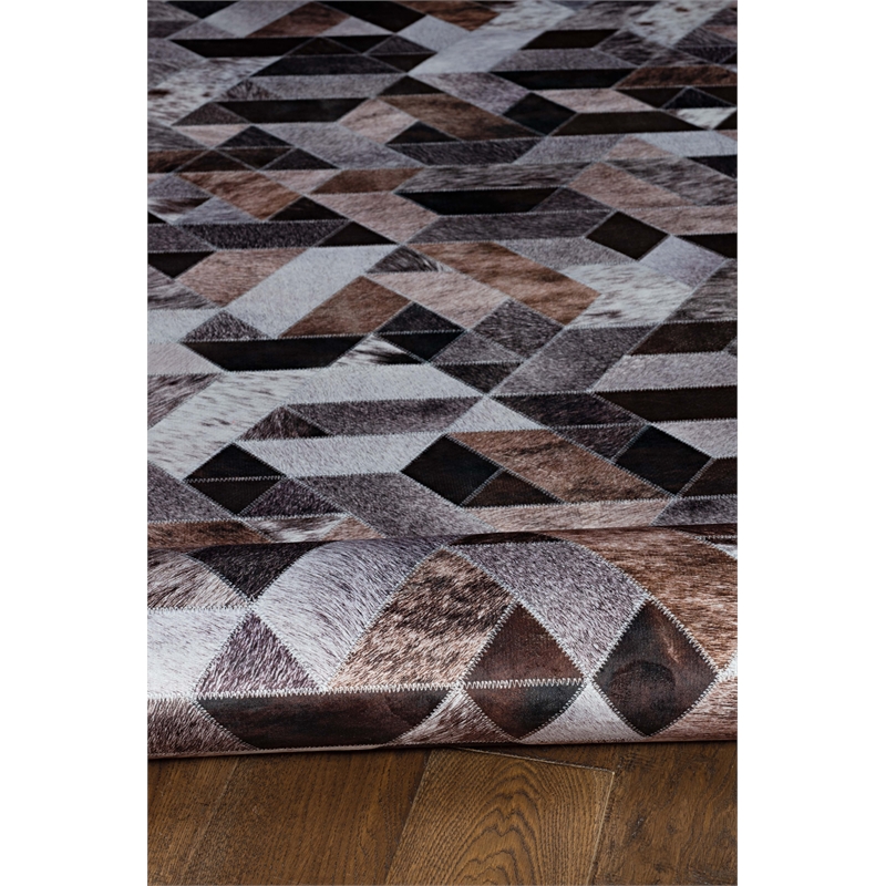Bowery Hill Patchwork Polyester Faux Cowhide 5' X 7' Area Rug in Brown