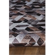 Bowery Hill Patchwork Polyester Faux Cowhide 5' X 7' Area Rug in Brown