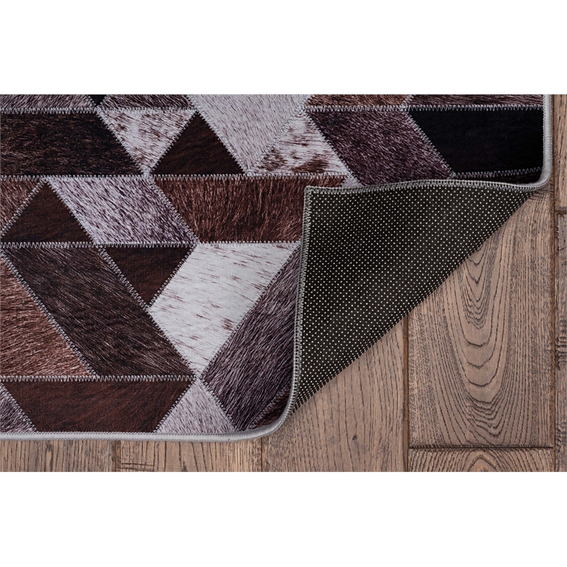 Bowery Hill Patchwork Polyester Faux Cowhide 5' X 7' Area Rug in Brown