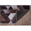 Bowery Hill Patchwork Polyester Faux Cowhide 5' X 7' Area Rug in Brown