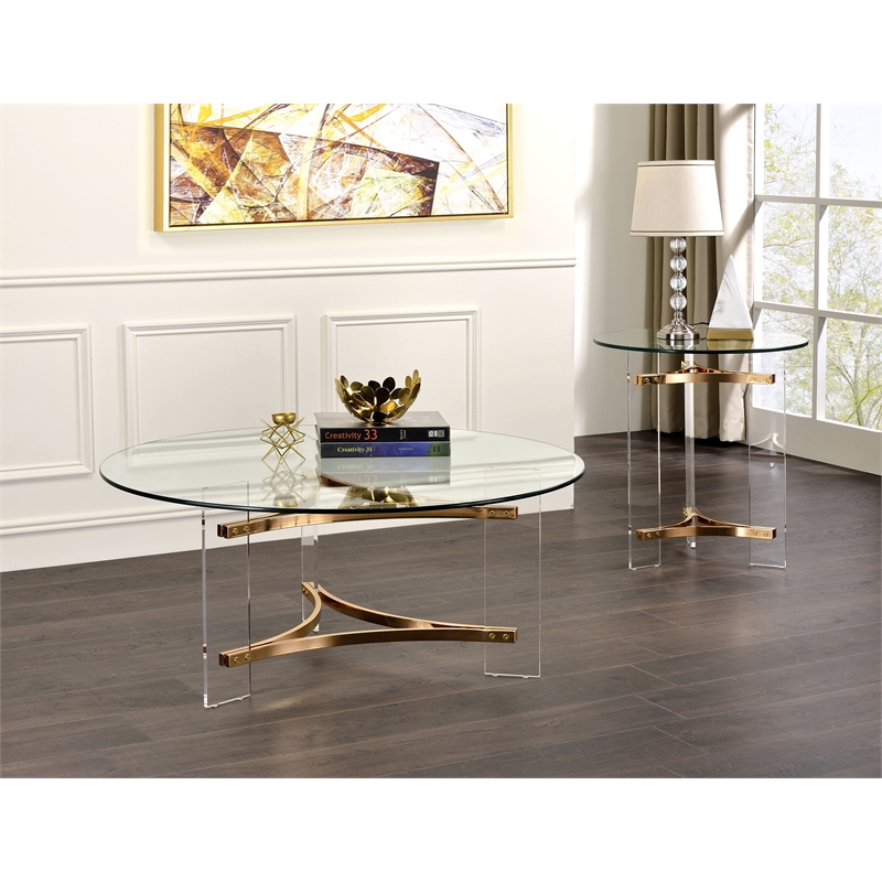 Bowery Hill Round Glass Coffee Table with Acrylic Legs in Gold and Clear