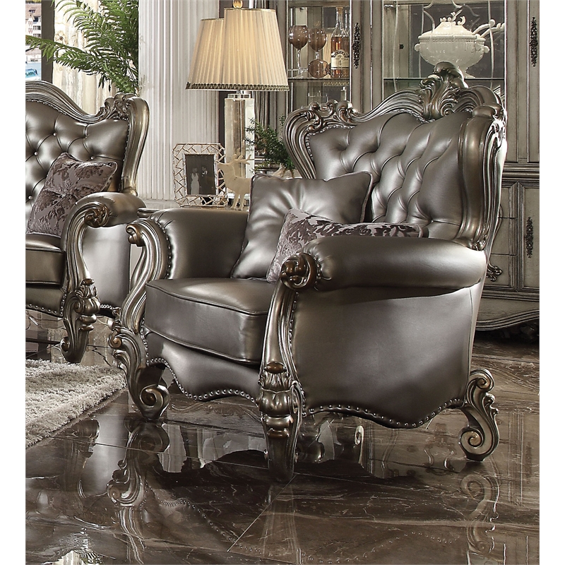 Bowery Hill Wing Back Chair in Silver Faux Leather with Antique Platinum Trim