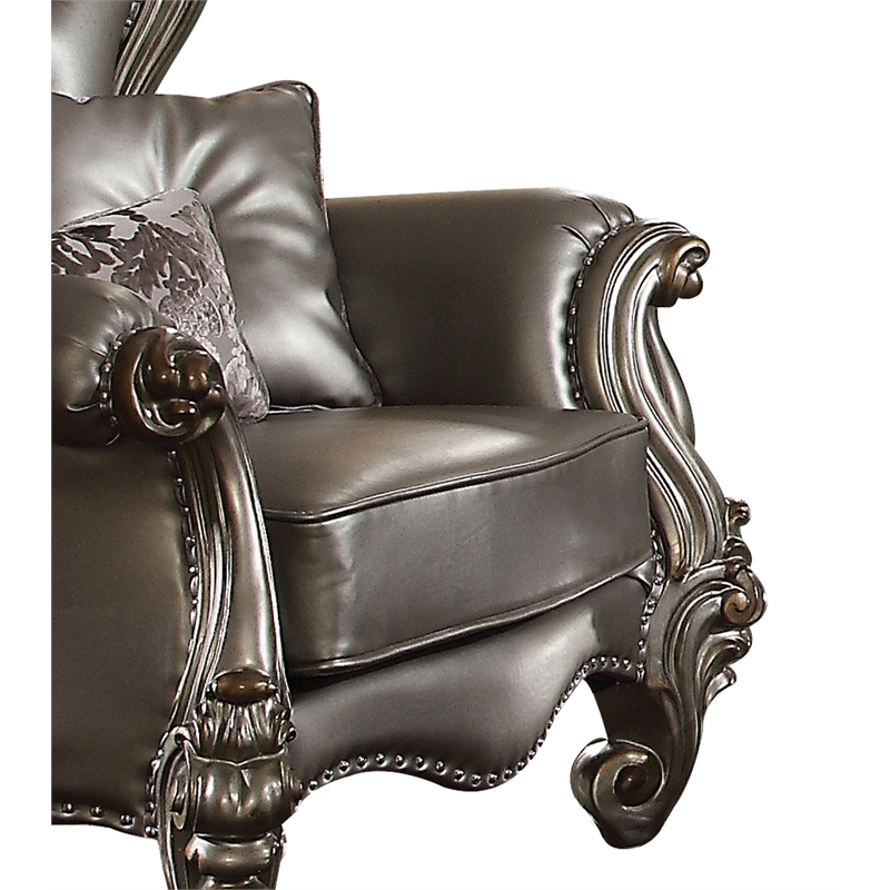 Bowery Hill Wing Back Chair in Silver Faux Leather with Antique Platinum Trim