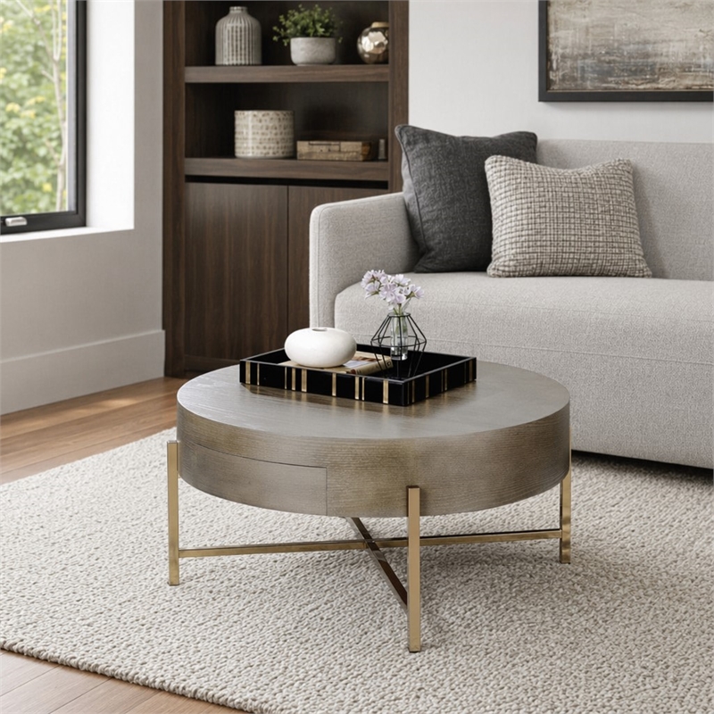 Bowery Hill Round Coffee Table with 1 Drawer and Champagne Metal Base