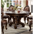 Bowery Hill Round Dining Table with Decorative Base in Cherry Finish
