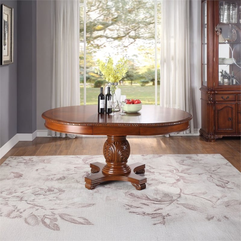 Bowery Hill Round Single Pedestal Dining Table with Removable Leaf in Cherry