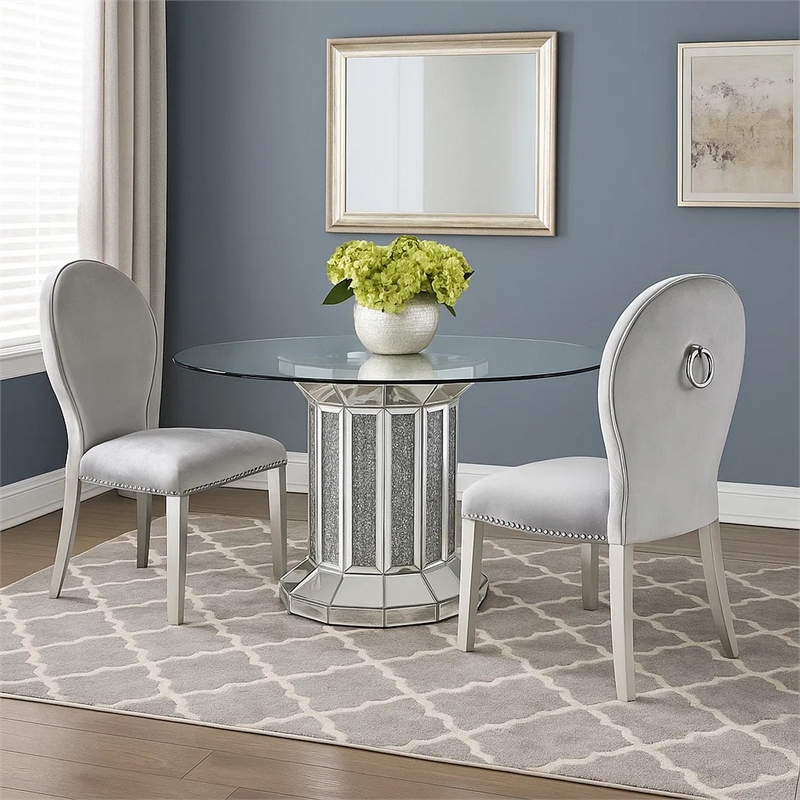 Bowery Hill Round Glass Top Dining Table with Cross Oval Base in Silver