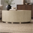 Bowery Hill Round Cocktail Table with Champagne Metal Base in Taupe