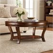 Bowery Hill Round Glass Cocktail Table with Starburst Inlay in Clear