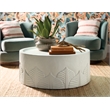 Bowery Hill Round Cocktail Table in White Wood with Embossed Finish