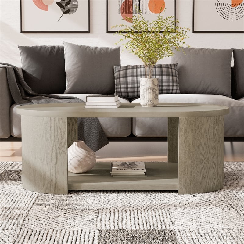 Bowery Hill Wood Oval 1-Shelf Cocktail Table in Oak Finish