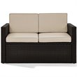Pemberly Row Wicker Patio Loveseat In Brown with Sand Cushions