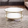 Pemberly Row Round Metal Base Coffee Table in Brass with Glass Top