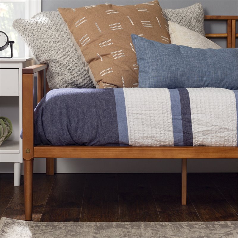 Pemberly Row Spindle Tapered Front Legs Solid Wood Daybed in Brown/Caramel