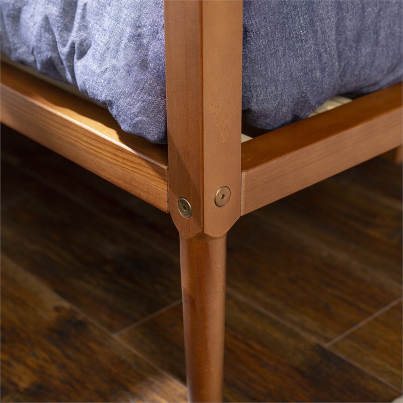 Pemberly Row Spindle Tapered Front Legs Solid Wood Daybed in Brown/Caramel