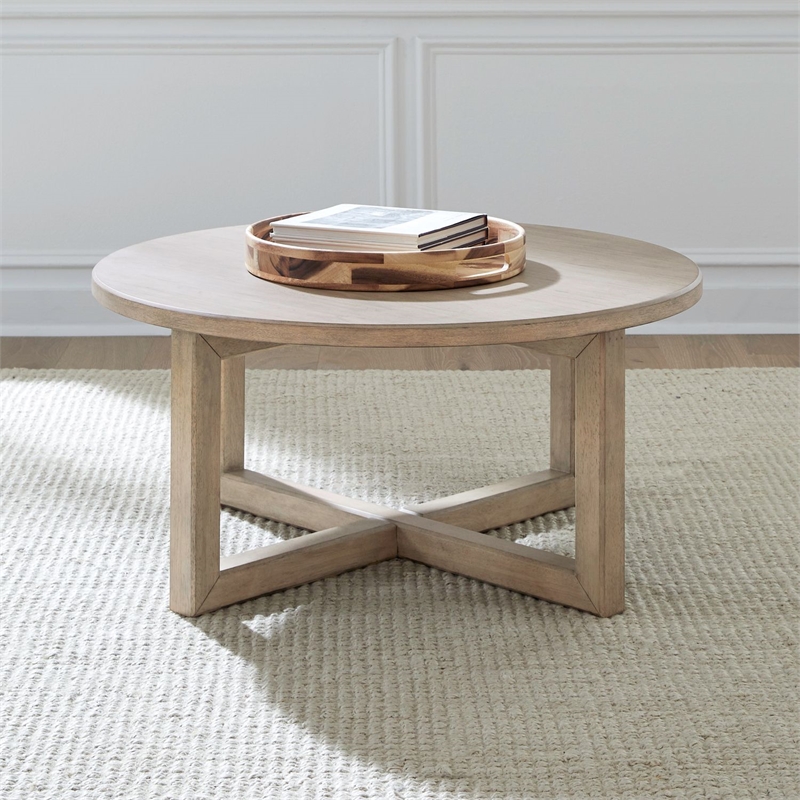 Pemberly Row Solid Wood Round Cocktail Table with Drawer in Brown