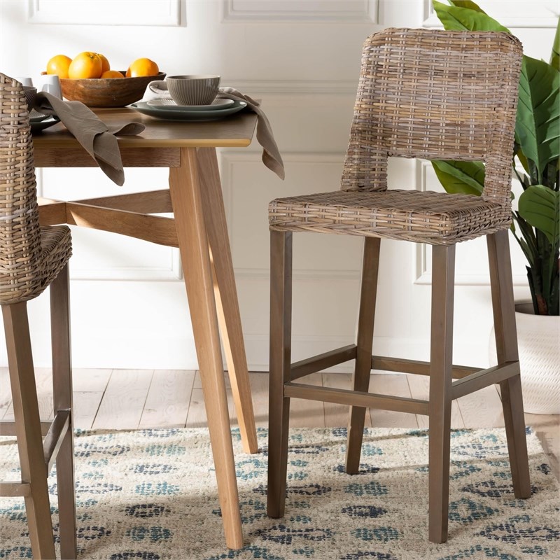 Pemberly Row Gray Kubu Rattan and Mahogany Wood Bar Stool with Footrest