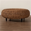 Pemberly Row Handwoven Seagrass Round Coffee Table with Turned Legs