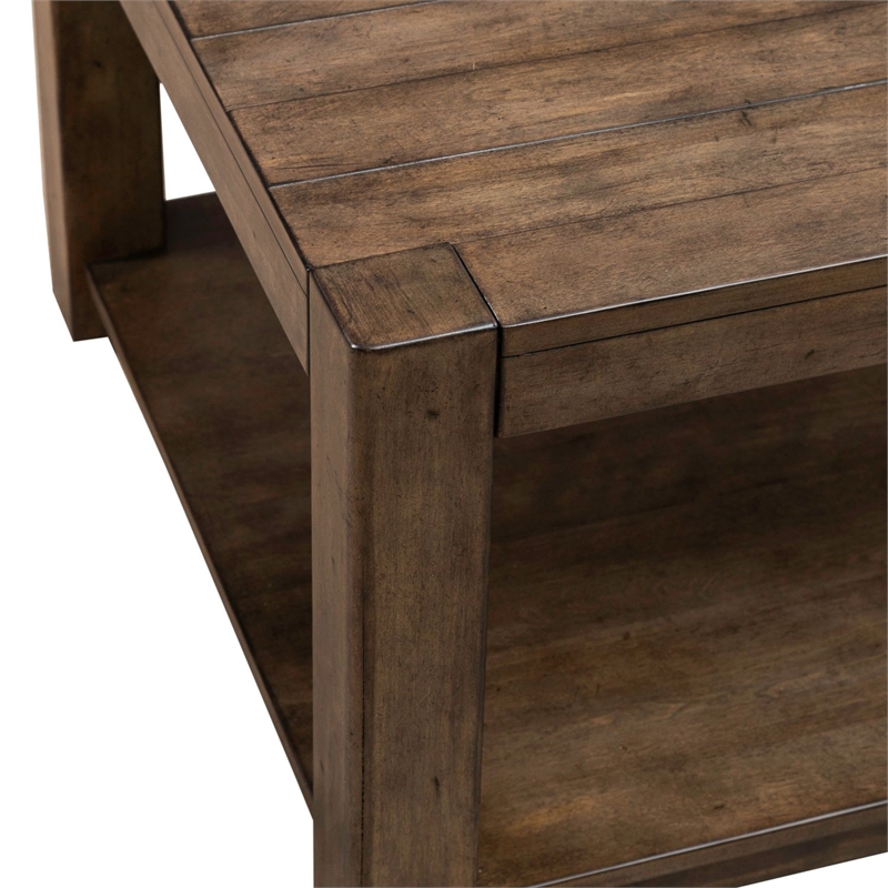 Pemberly Row Rectangular Cocktail Table with Casters and Open Shelf in Brown