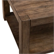 Pemberly Row Rectangular Cocktail Table with Casters and Open Shelf in Brown