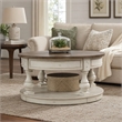 Pemberly Row Round Cocktail Table with Nailhead Accents and Shelf in White