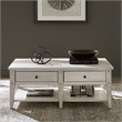 Pemberly Row Cocktail Table with Push-Through Drawers in Weathered White Finish