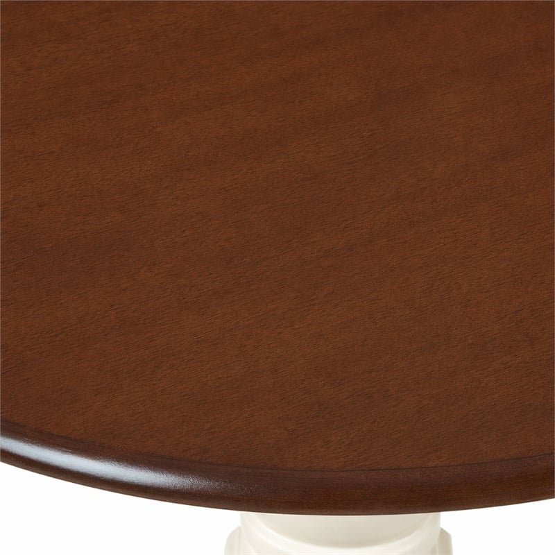 Pemberly Row Round Rubberwood Dining Table in Mahogany Finish