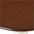 Pemberly Row Round Rubberwood Dining Table in Mahogany Finish
