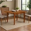 Pemberly Row Rectangular Extendable Wood Dining Table in Saddle Brown Finish