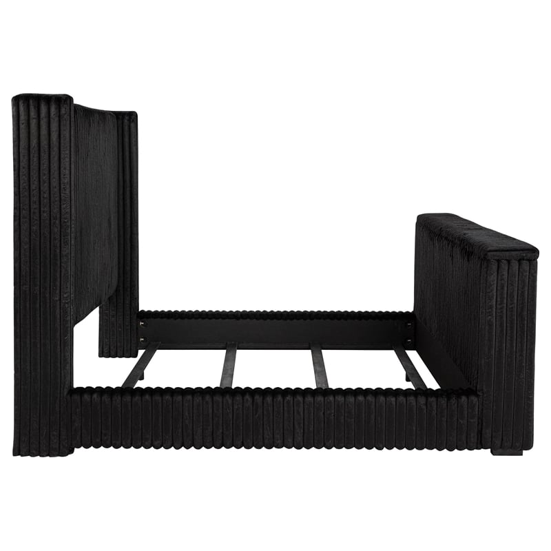 Pemberly Row Upholstered Velvet Eastern King Wingback TV Bed in Black