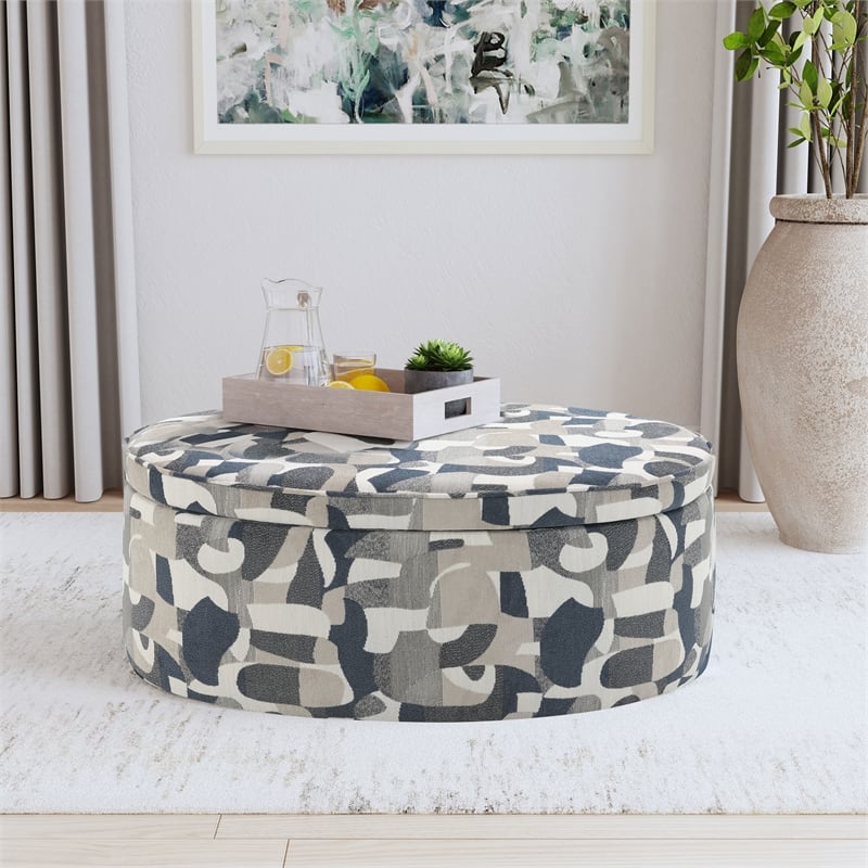 Pemberly Row Oval Upholstered Storage Ottoman in Indigo Blue