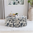 Pemberly Row Oval Upholstered Storage Ottoman in Indigo Blue