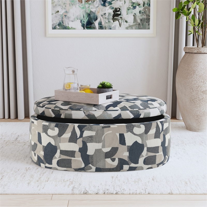 Pemberly Row Oval Upholstered Storage Ottoman in Indigo Blue