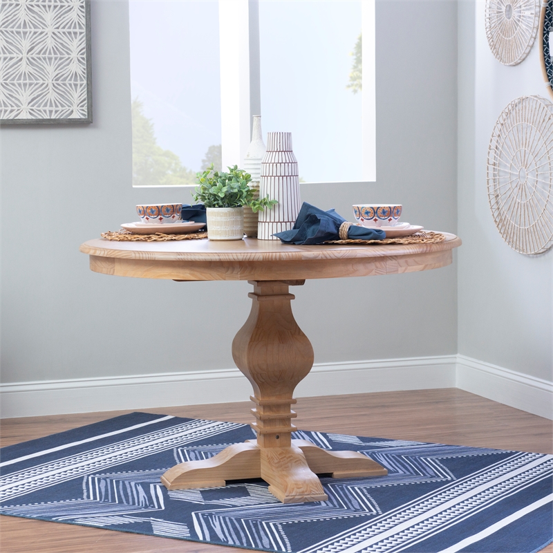 Pemberly Row Round Pine Pedestal Dining Table in Rustic Honey Finish