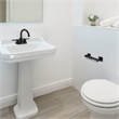 Pemberly Row Millbridge Metal Toilet Paper Holder in Matte Black