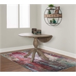 Maklaine Round Drop Leaf Pedestal Dining Table in Rustic Gray Washed Wood