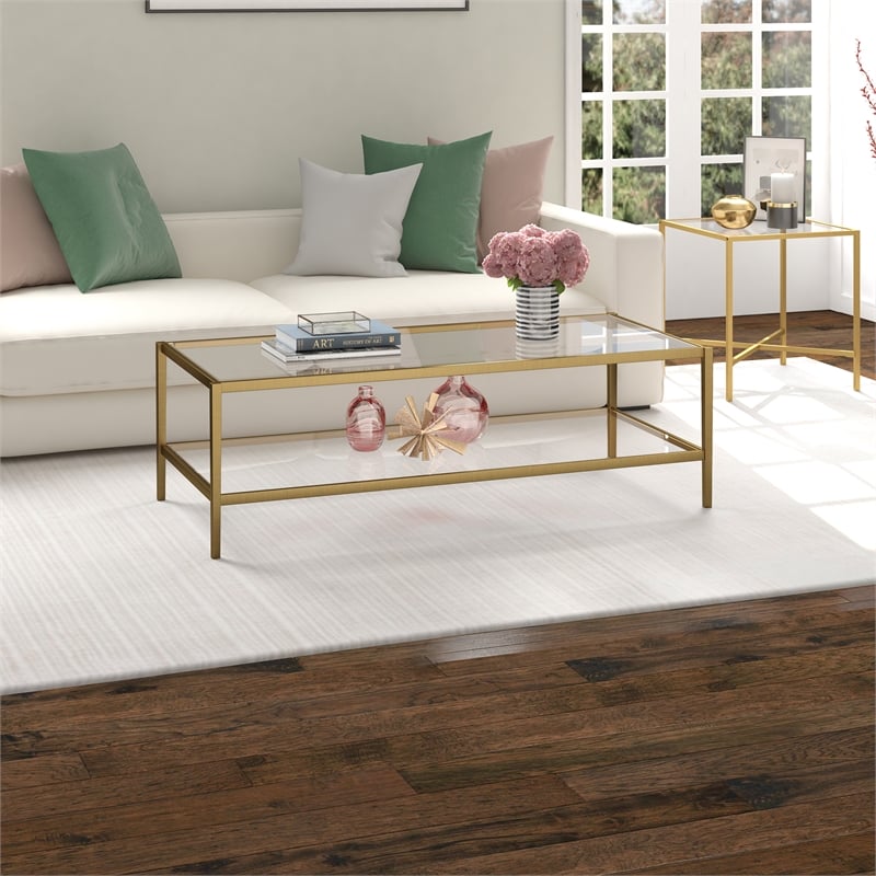 Henn&Hart 54 in. Antique Brass Finish Coffee Table with Clear Glass Shelf