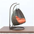 LeisureMod Outdoor Beige Wicker Hanging Double Egg Swing Chair in Orange