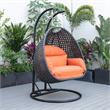 LeisureMod Mendoza Charcoal Wicker Patio Double Swing Chair in Orange