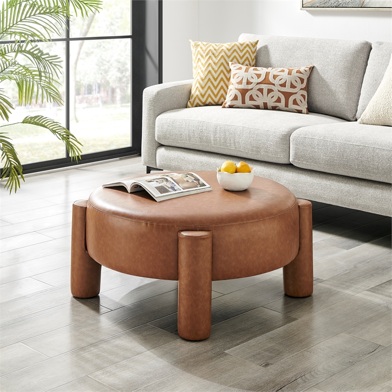 NPD Furniture Elora Faux Leather Round Ottoman in Vintage Cider