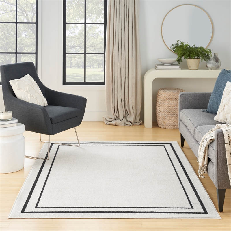 Nourison Essentials 6' x 9' Ivory Black Fabric Contemporary Area Rug (6' x 9')