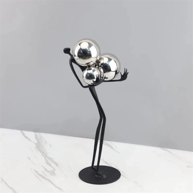 Human Sculpture with Decorative Metal Balls