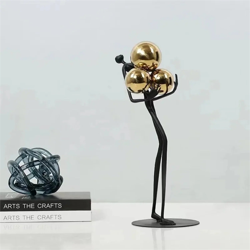 Human Sculpture with Decorative Metal Balls