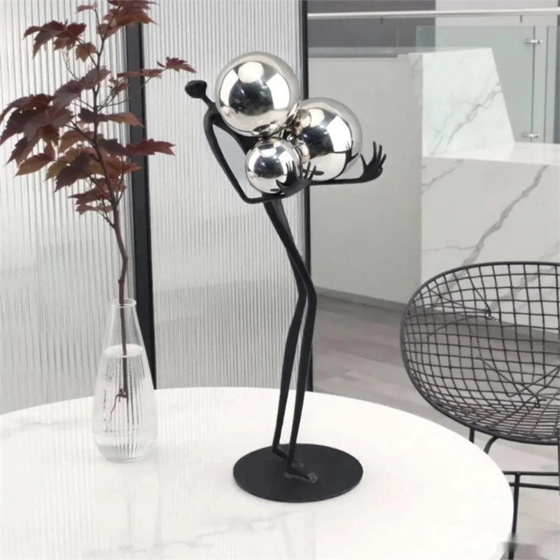 Human Sculpture with Decorative Metal Balls