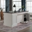 Sauder Palladia Engineered Wood Executive Desk in Glacier Oak/Rosso Slate Accent