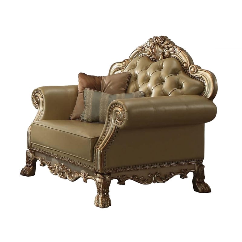 Benjara Traditional Button Tufted Leatherette Chair with Carved Details- Gold