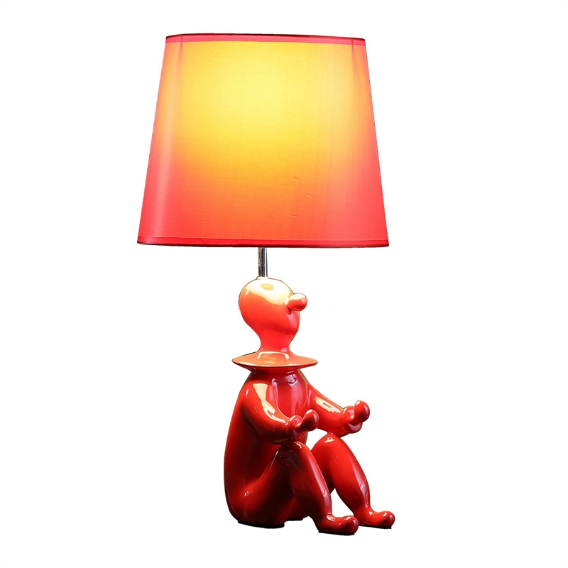 Benjara Fabric Shade Table Lamp with Polyresin Sitting Clown Base- Red